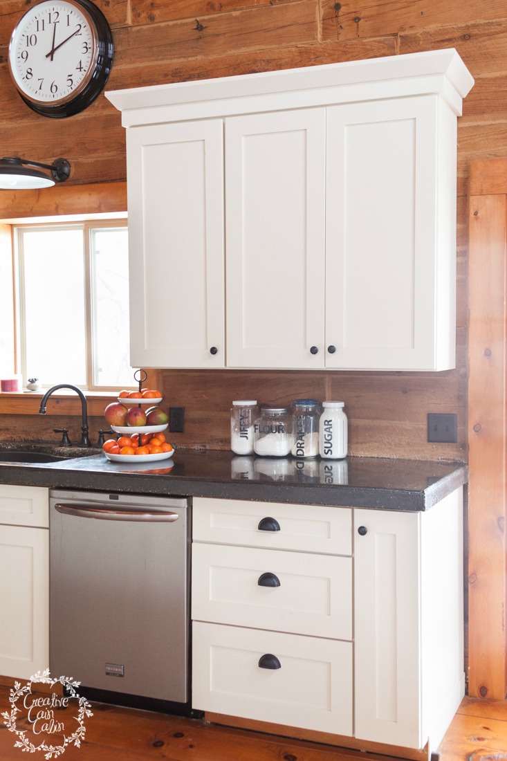 Log Home Kitchen with White Cabinet & Black Concrete Countertops  | creativecaincabin.com
