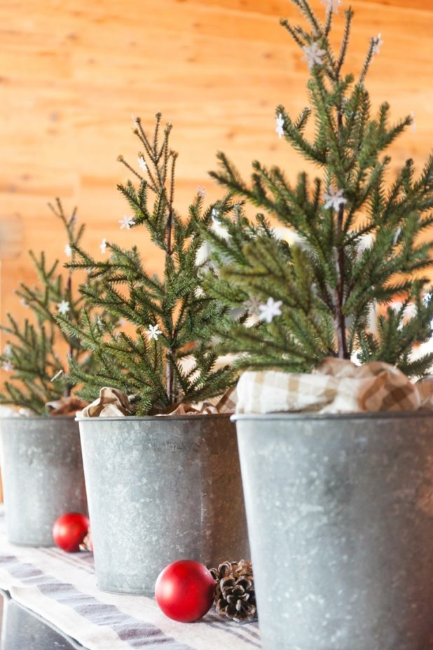 Kitchen Christmas Trees in Galvanized Buckets Dotted with Glitter Paper Snowflakes