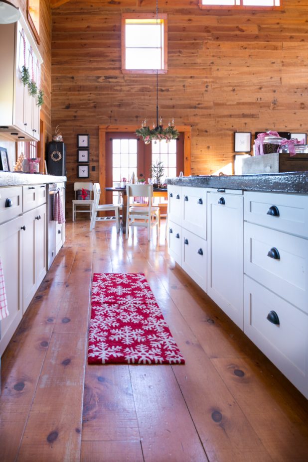 Christmas Kitchen in a Log Home Using Red & White Gingham, Plaid, Pinecones, and Wood Decorations