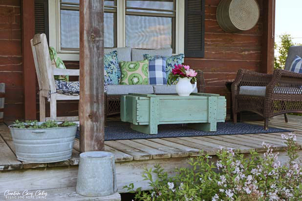 Log Home Porch, Wicker Furniture, Peonies, Blue and Green Decor, Galvanized Buckets